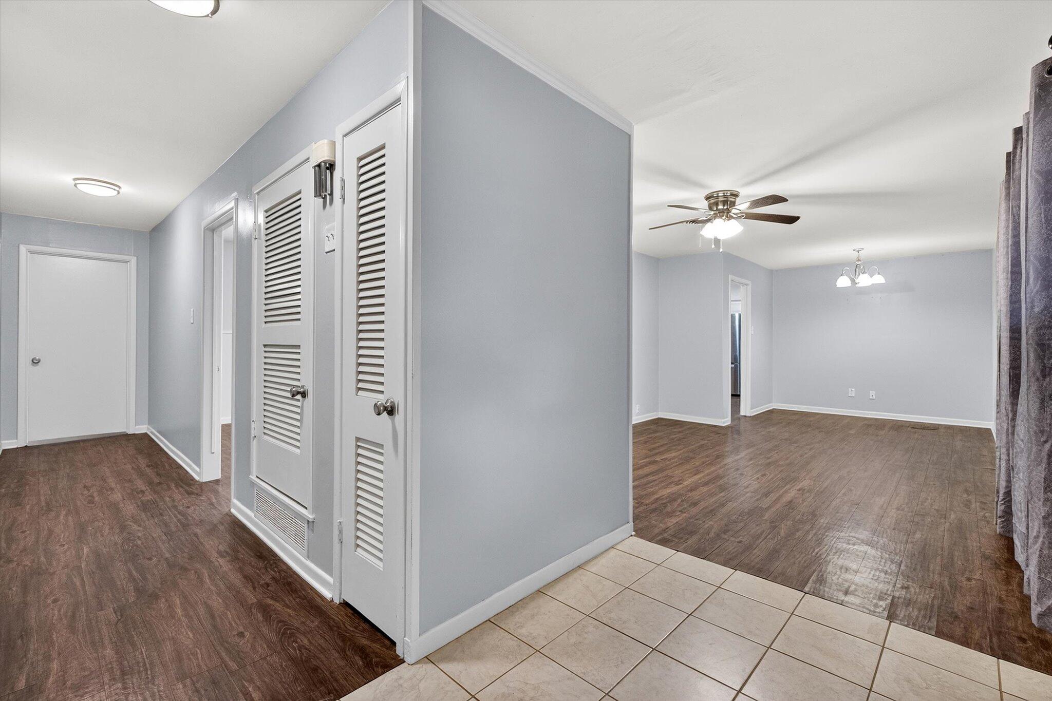 4915 17th Street Lubbock, TX 79416 - Photo 25 of 29 a view of a livingroom with a ceiling fan and wooden floor