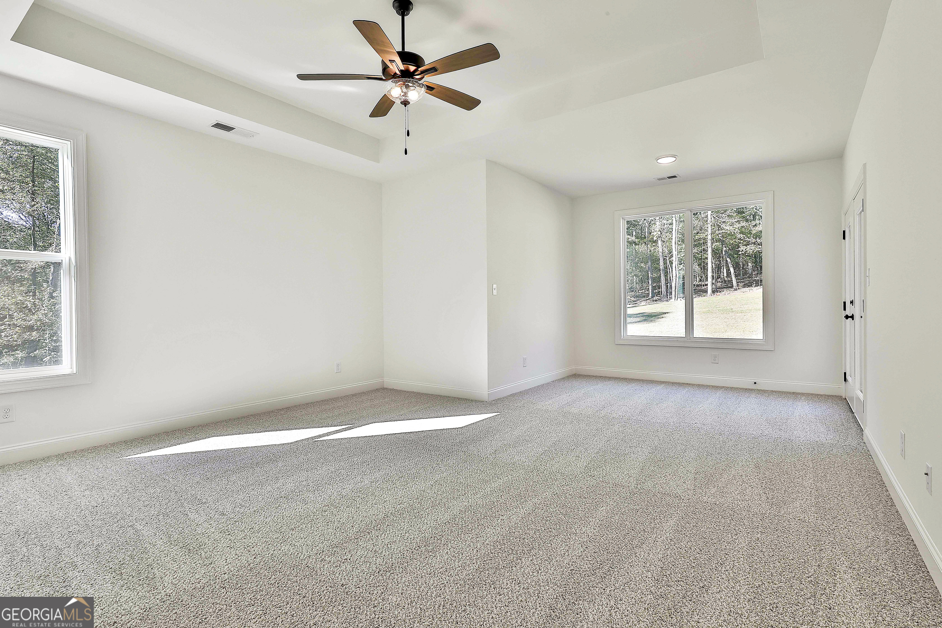 766 Wisteria Lane, Unit 55 Williamson, GA 30292 - Photo 30 of 52 a view of an empty room with a window