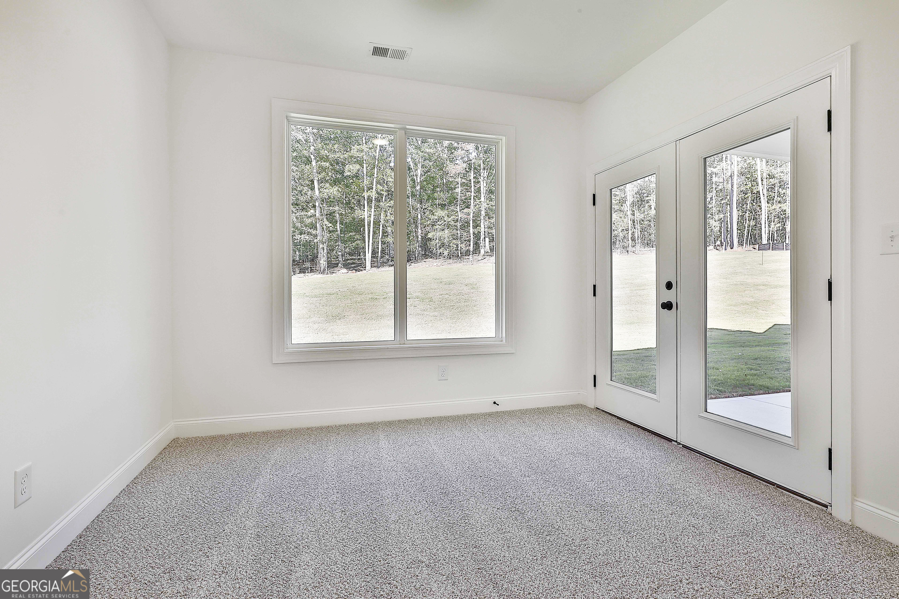 766 Wisteria Lane, Unit 55 Williamson, GA 30292 - Photo 32 of 52 an empty room with windows