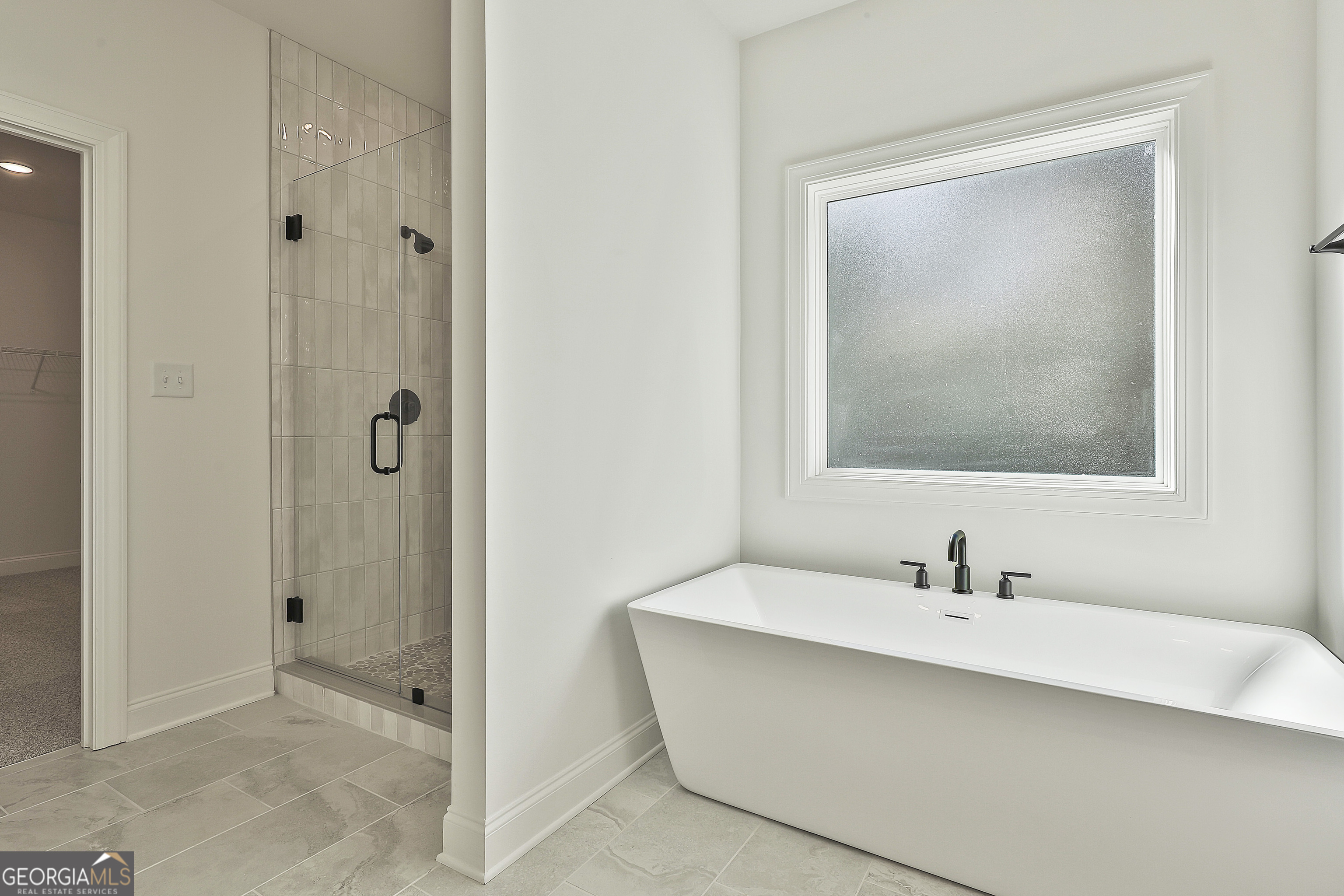 766 Wisteria Lane, Unit 55 Williamson, GA 30292 - Photo 34 of 52 a bathroom with a sink and a mirror