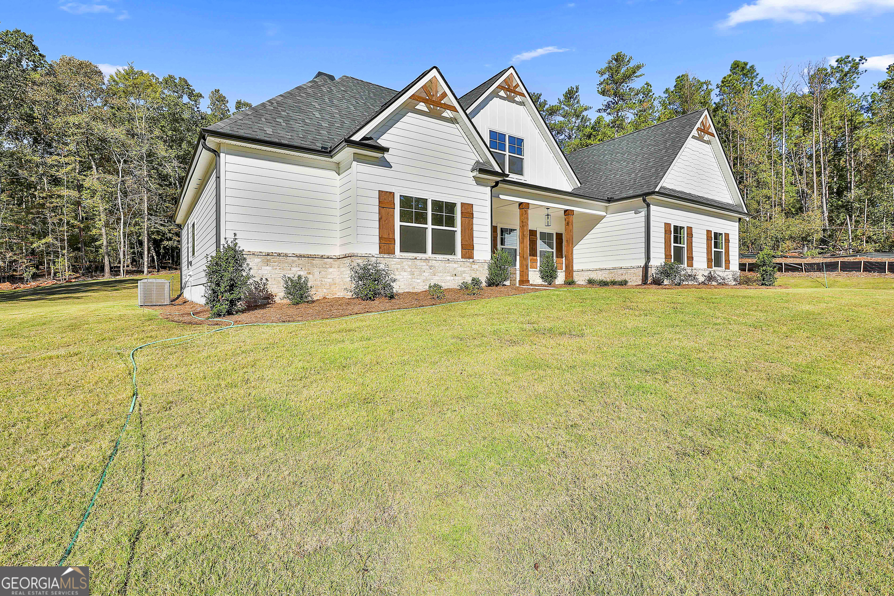 766 Wisteria Lane, Unit 55 Williamson, GA 30292 - Photo 4 of 52 a view of a house with a yard