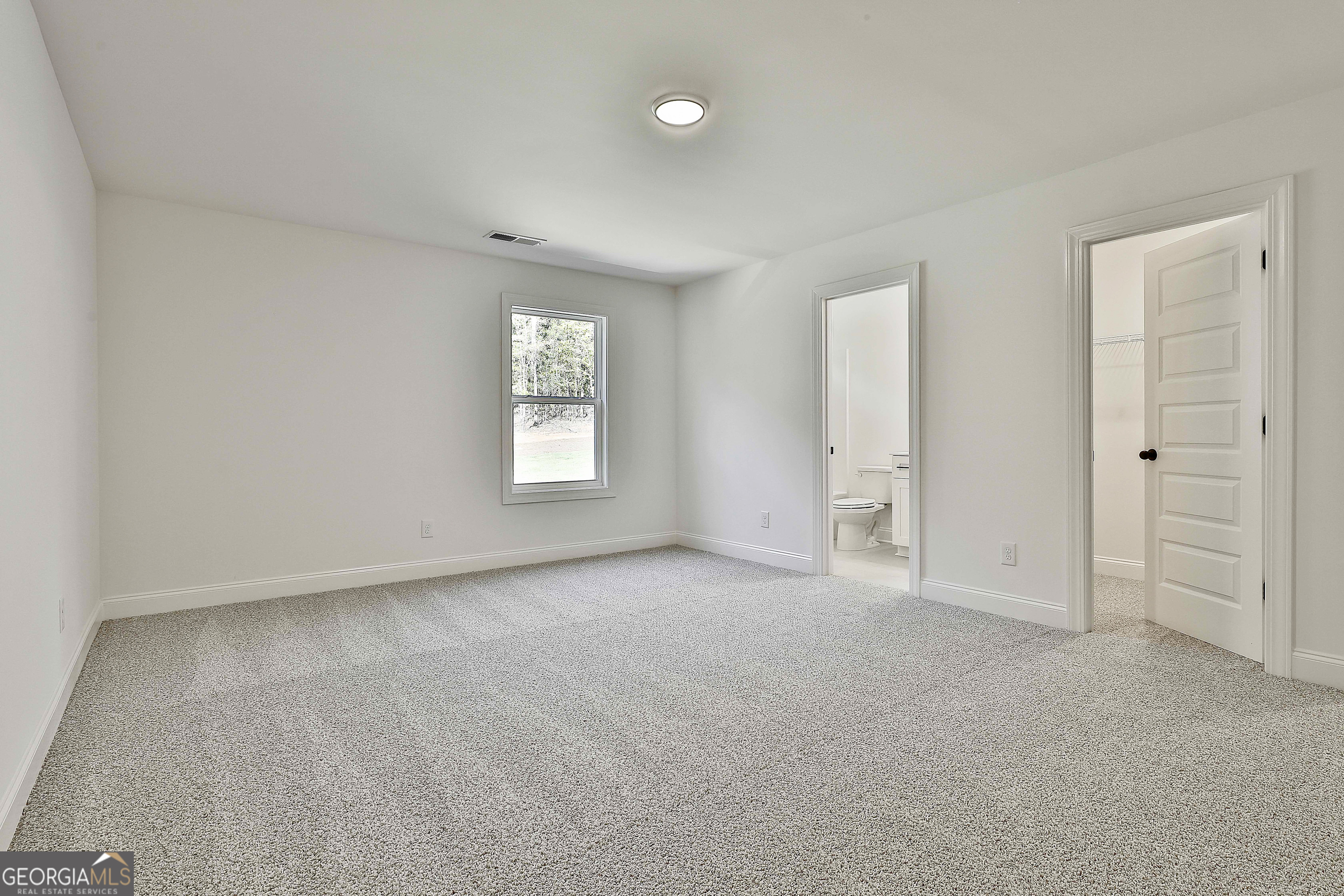 766 Wisteria Lane, Unit 55 Williamson, GA 30292 - Photo 41 of 52 an empty room with windows and closet