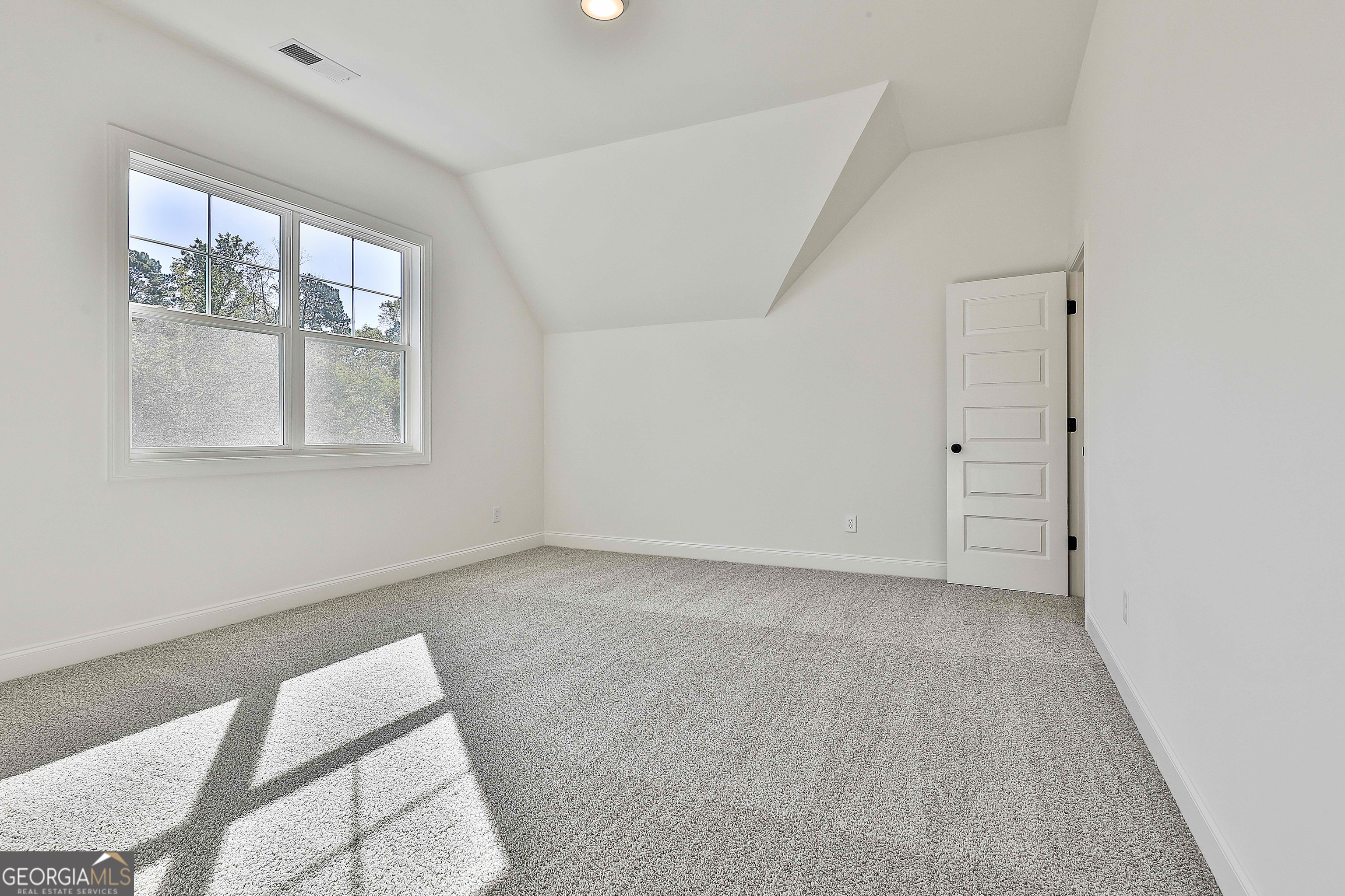 766 Wisteria Lane, Unit 55 Williamson, GA 30292 - Photo 43 of 52 an empty room with windows