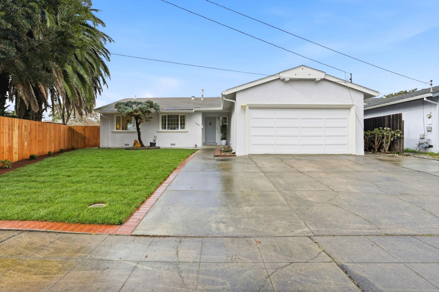 36465 Hafner Street Newark, CA 94560 - Photo 1 of 1 a view of a house with a yard and potted plants
