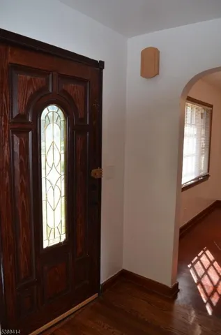 a view of entryway and wooden floor