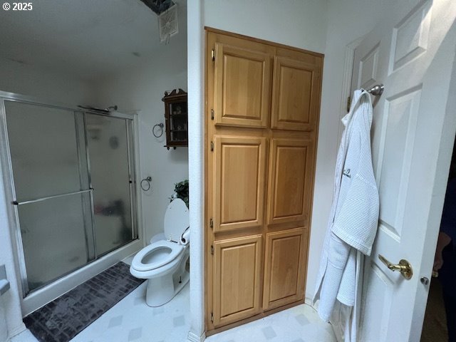 57418 Woodland Road Coquille, OR 97423 - Photo 11 of 39 a bathroom with a granite countertop toilet and a shower