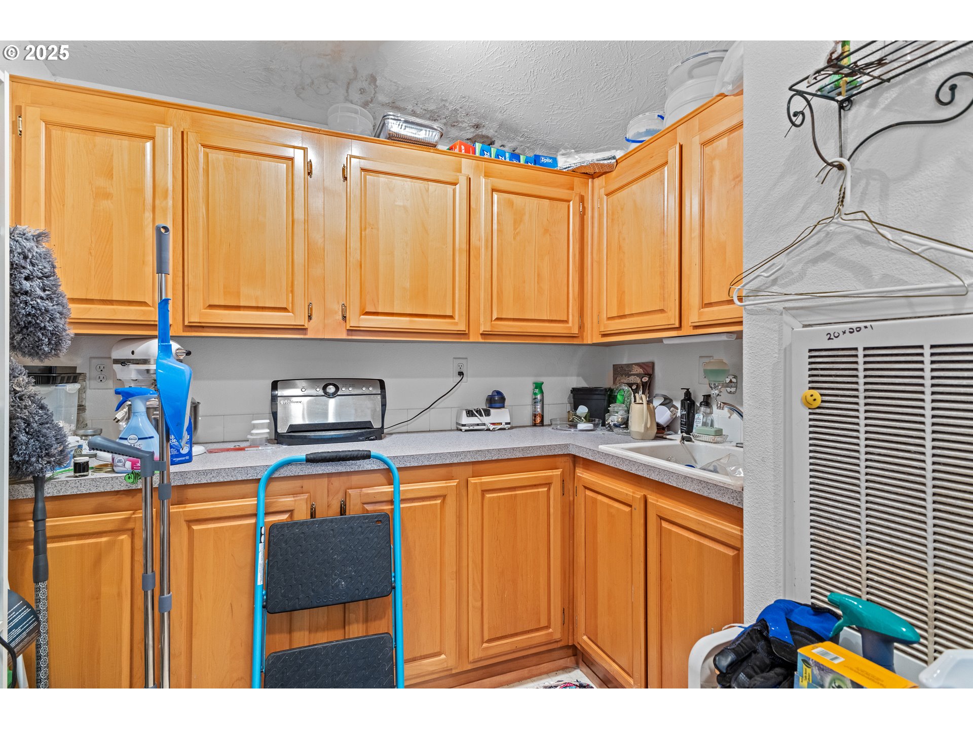 57418 Woodland Road Coquille, OR 97423 - Photo 16 of 39 a kitchen with stainless steel appliances granite countertop a sink and cabinets