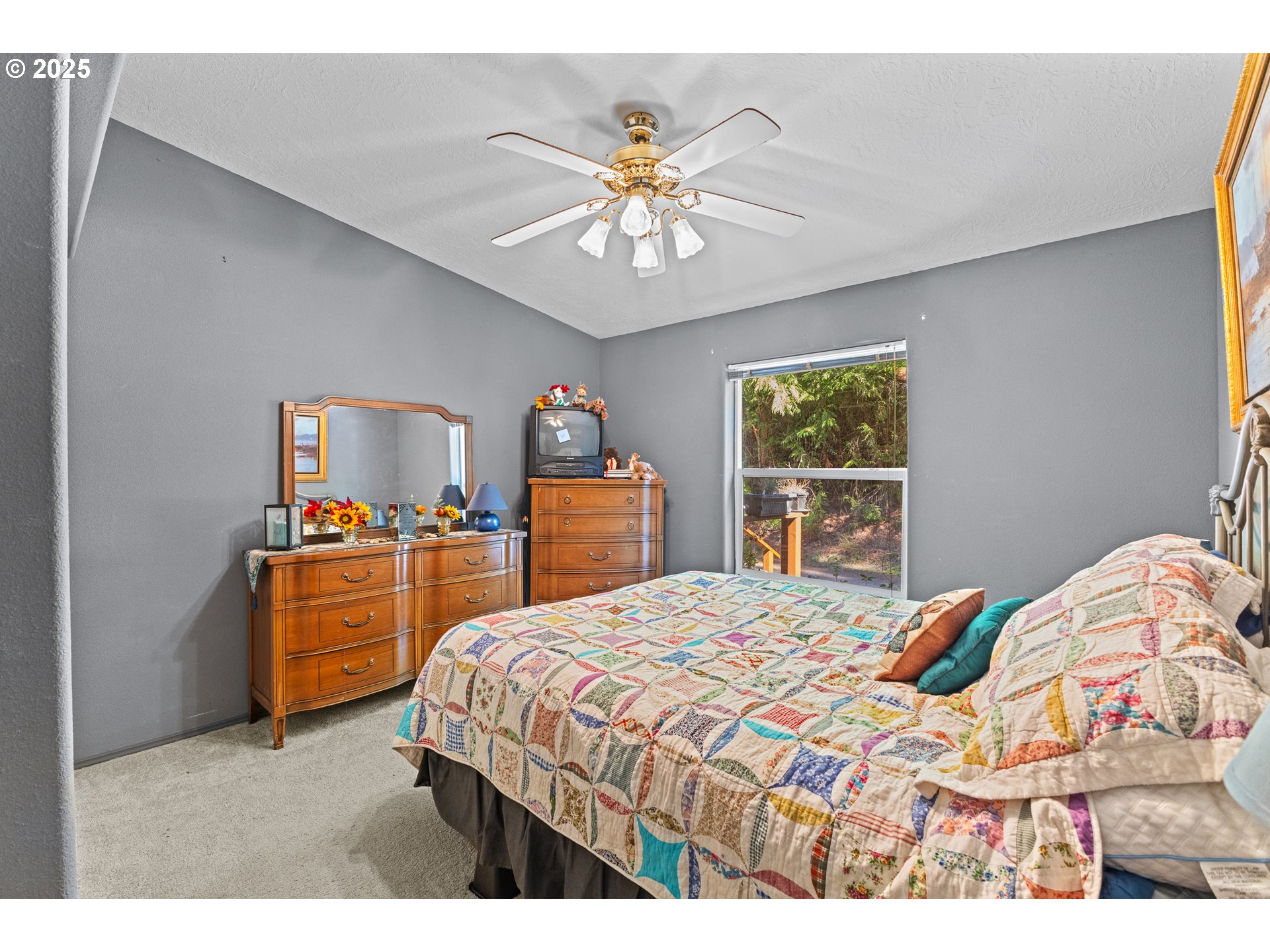 57418 Woodland Road Coquille, OR 97423 - Photo 19 of 39 a bedroom with a bed and dresser