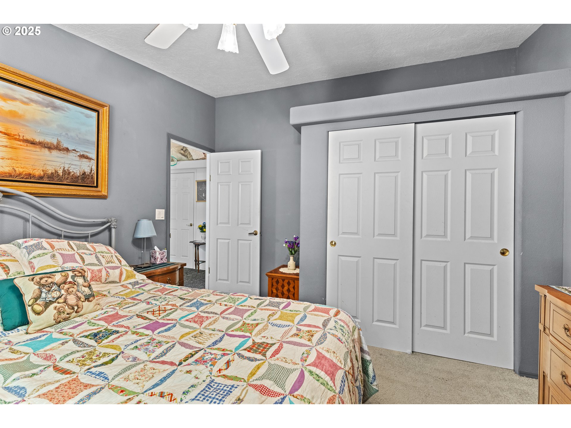 57418 Woodland Road Coquille, OR 97423 - Photo 20 of 39 a bedroom with a bed and a painting on the wall