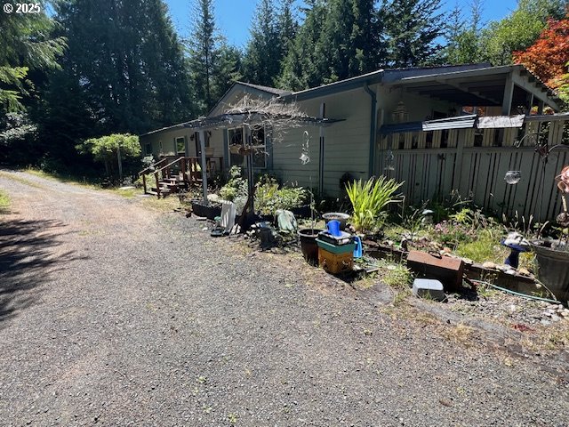 57418 Woodland Road Coquille, OR 97423 - Photo 2 of 39 a view of a backyard with a sitting area and furniture