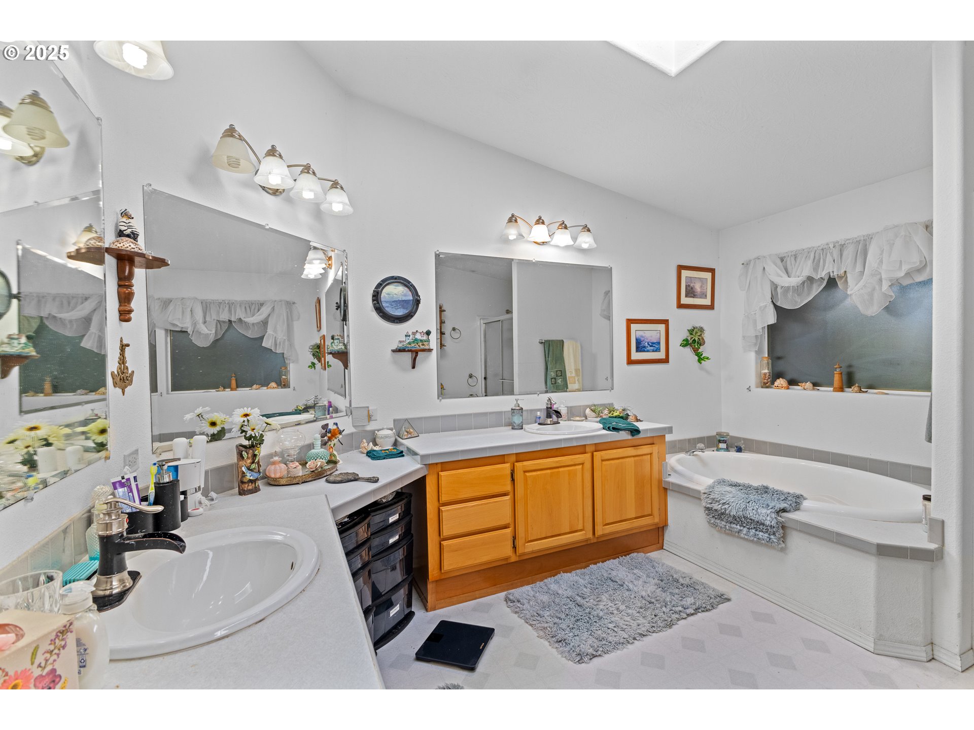 57418 Woodland Road Coquille, OR 97423 - Photo 27 of 39 a bathroom with a sink double vanity granite and a mirror