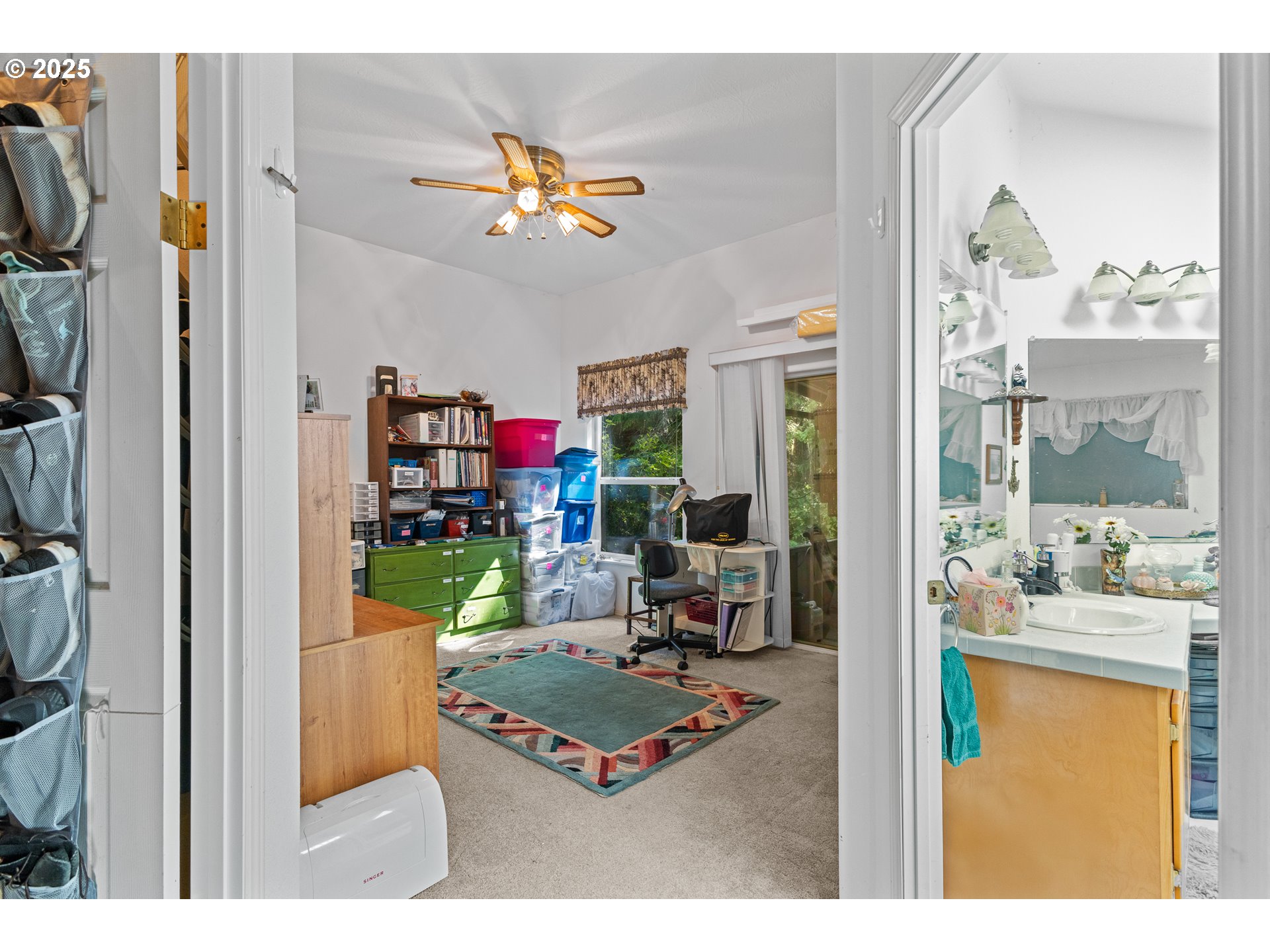 57418 Woodland Road Coquille, OR 97423 - Photo 29 of 39 a living room with patio furniture and a flat screen tv