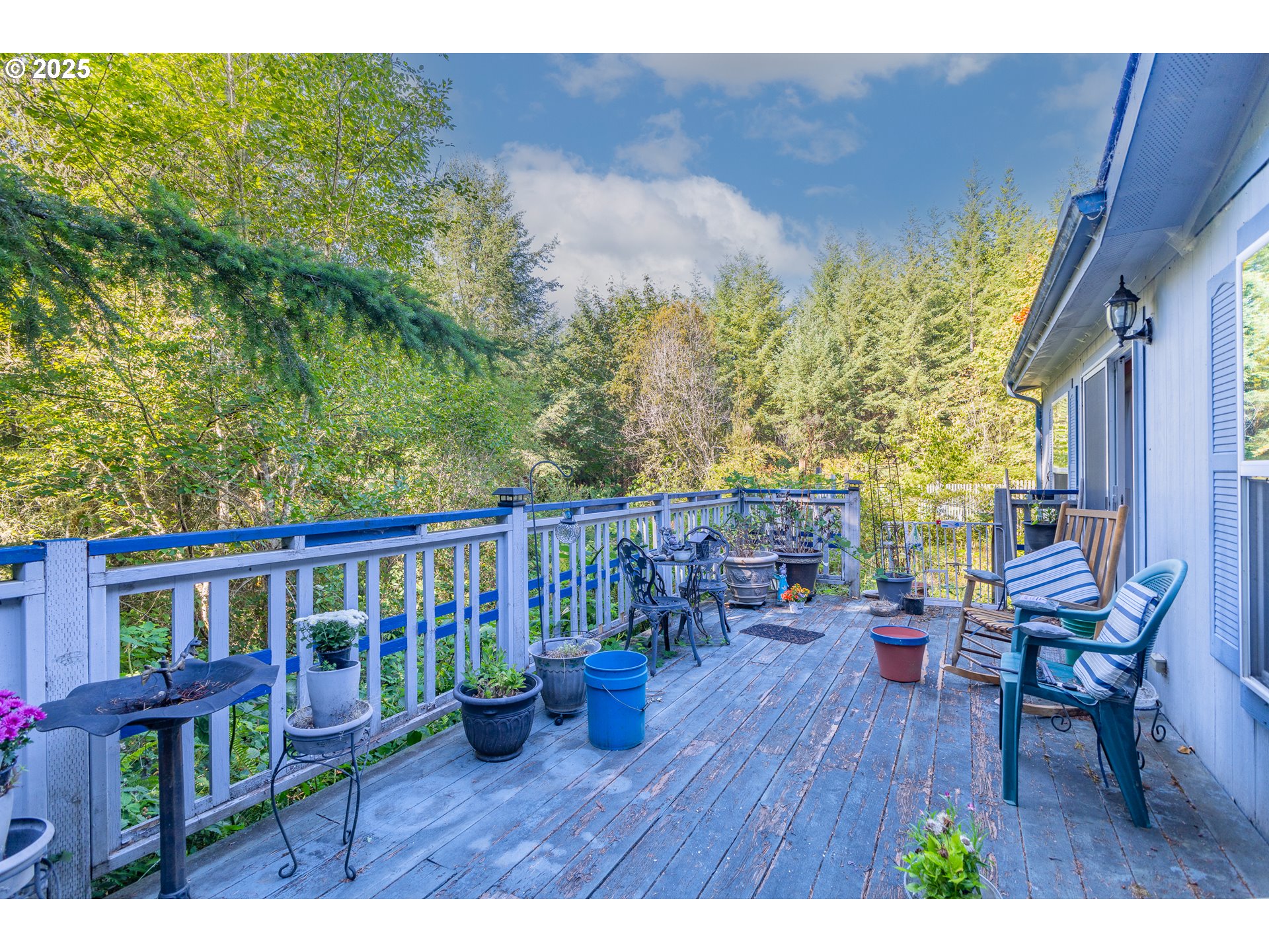 57418 Woodland Road Coquille, OR 97423 - Photo 33 of 39 a view of a deck with chairs and wooden floor