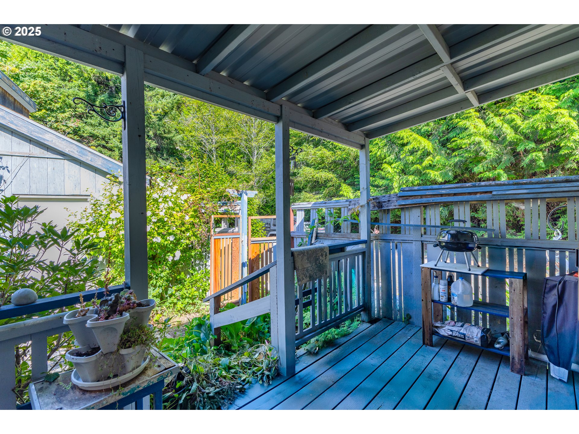 57418 Woodland Road Coquille, OR 97423 - Photo 34 of 39 a view of porch with a swing chair