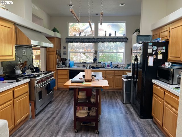 57418 Woodland Road Coquille, OR 97423 - Photo 6 of 39 a kitchen with counter space appliances wooden floor and a window