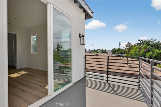 a view of a hallway with wooden door