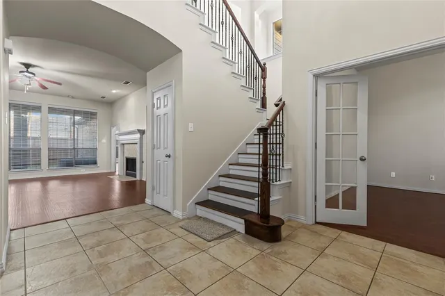 a view of entryway with stairs and wooden floor
