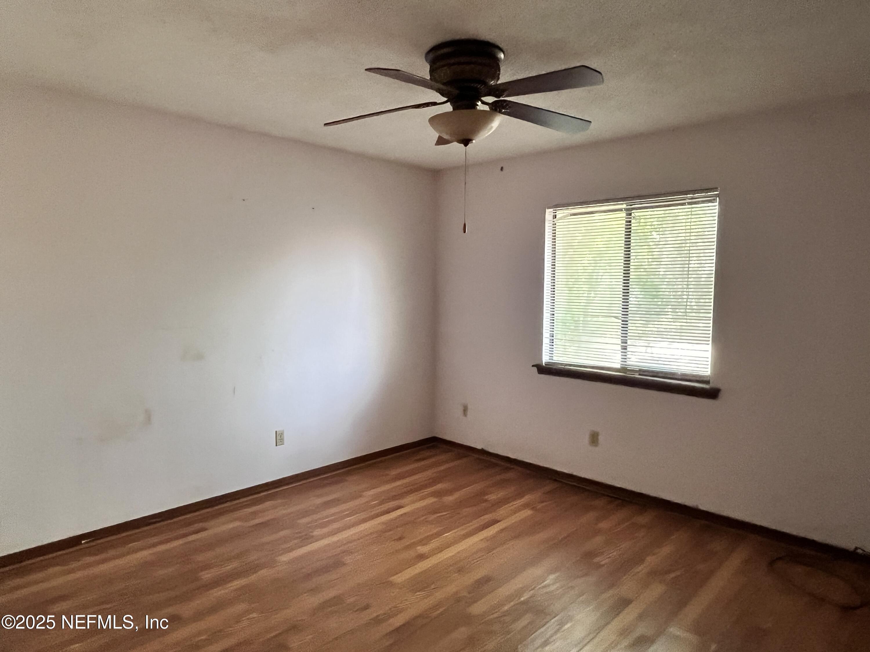 5511 Heckscher Drive Jacksonville, FL 32226 - Photo 16 of 19 an empty room with a window and a fan