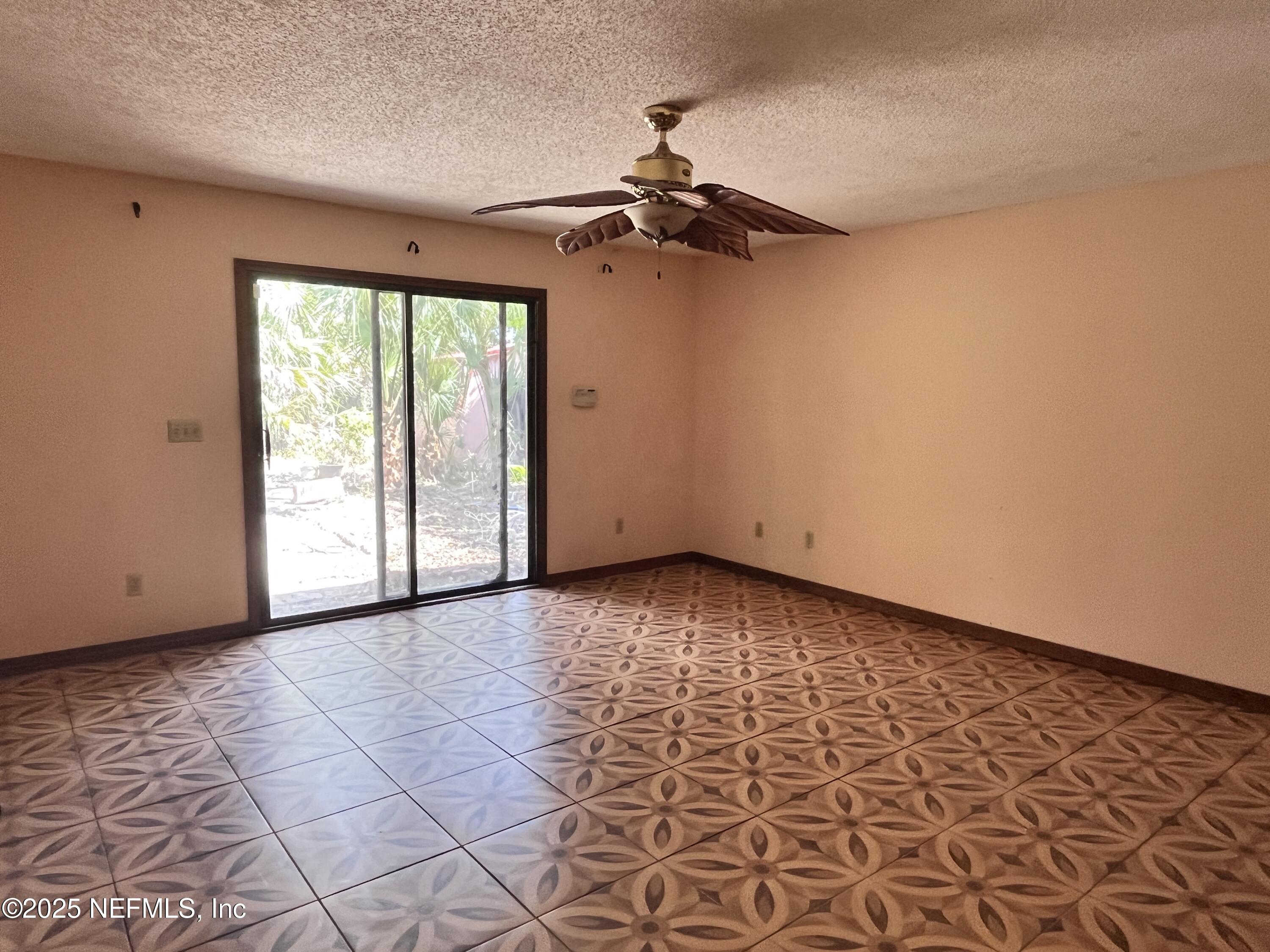 5511 Heckscher Drive Jacksonville, FL 32226 - Photo 17 of 19 en empty room with windows