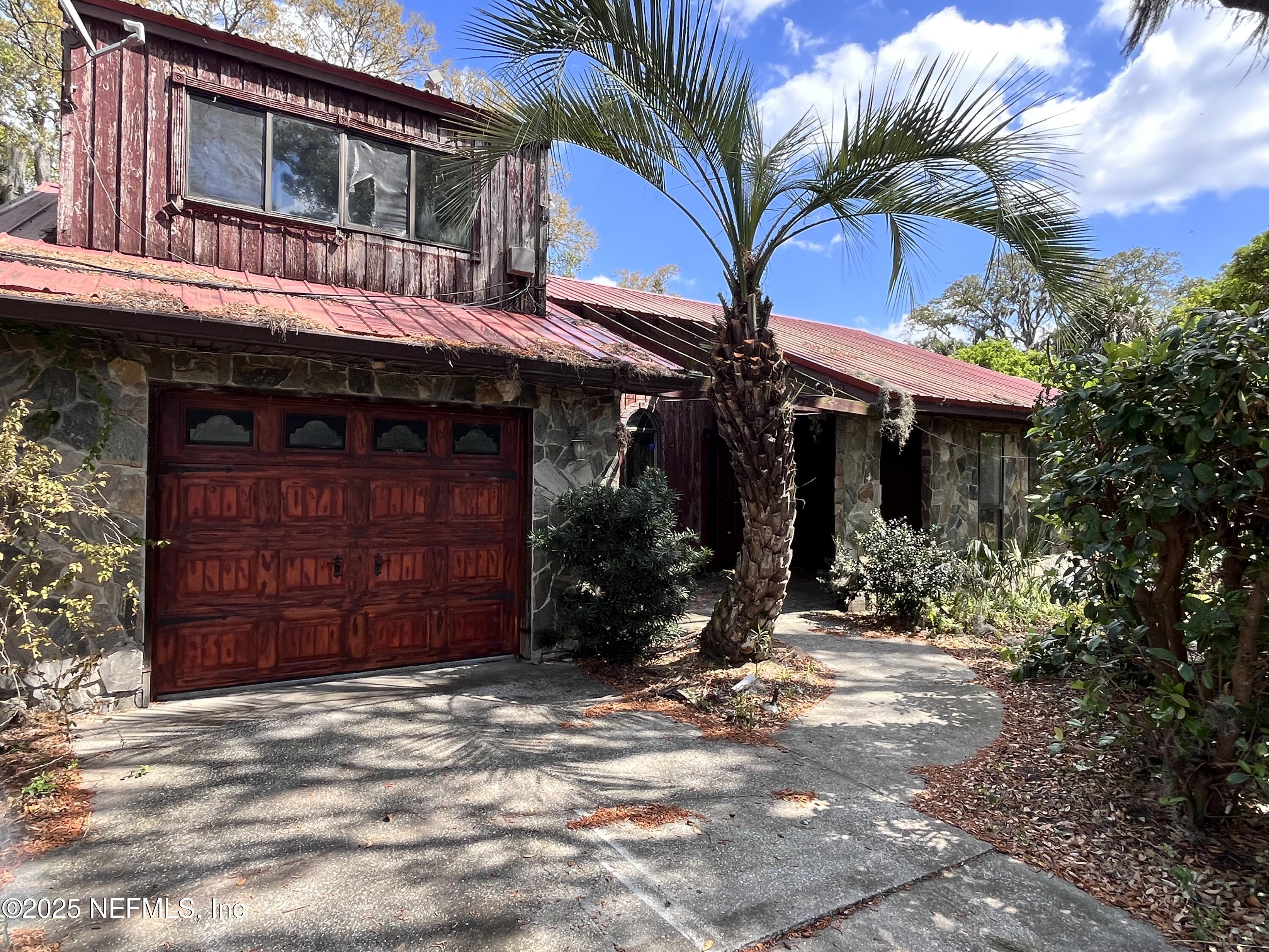 5511 Heckscher Drive Jacksonville, FL 32226 - Photo 2 of 19 a view of a house with a tree