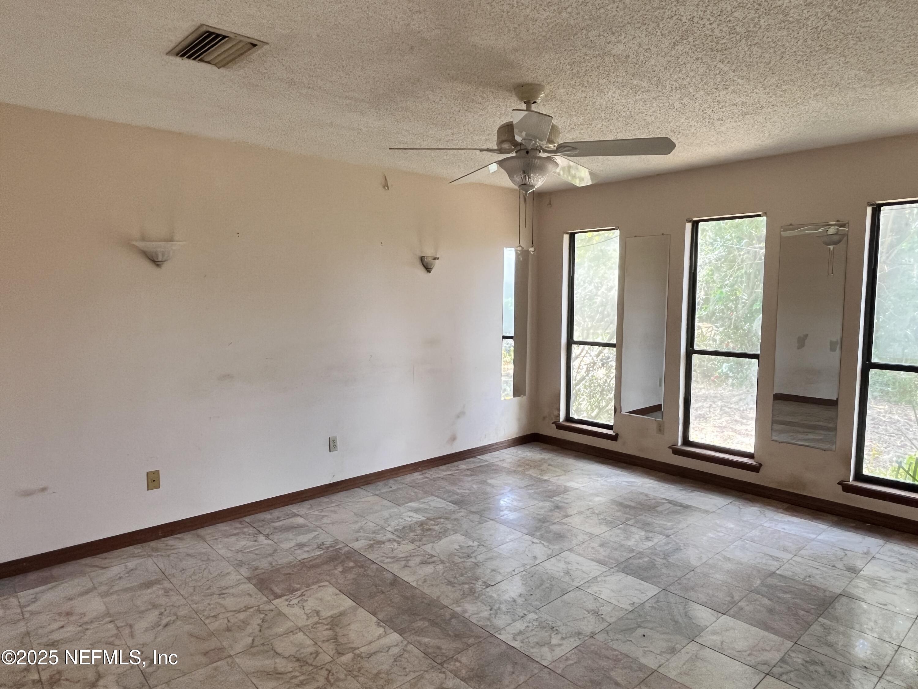 5511 Heckscher Drive Jacksonville, FL 32226 - Photo 10 of 19 a view of an empty room with a window