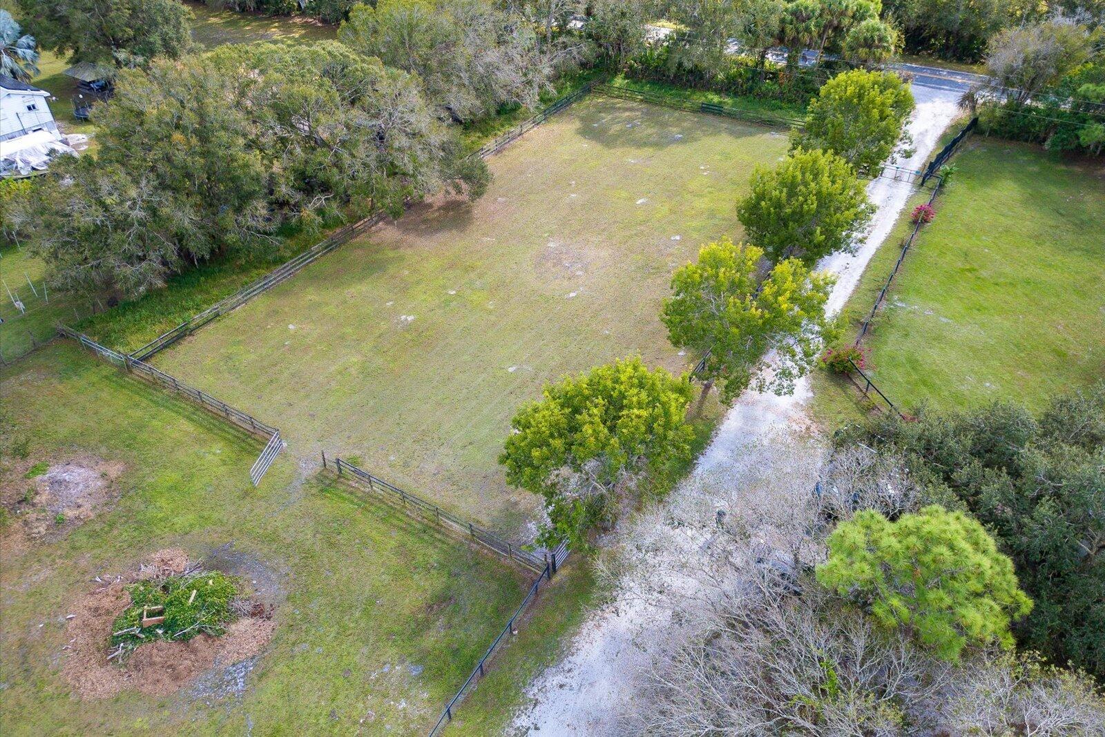 23801 Southwest Martin Highway Okeechobee, FL 34974 - Photo 17 of 85 a view of a lake with a yard
