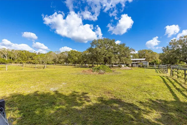 a room with wooden furniture and flat screen tv