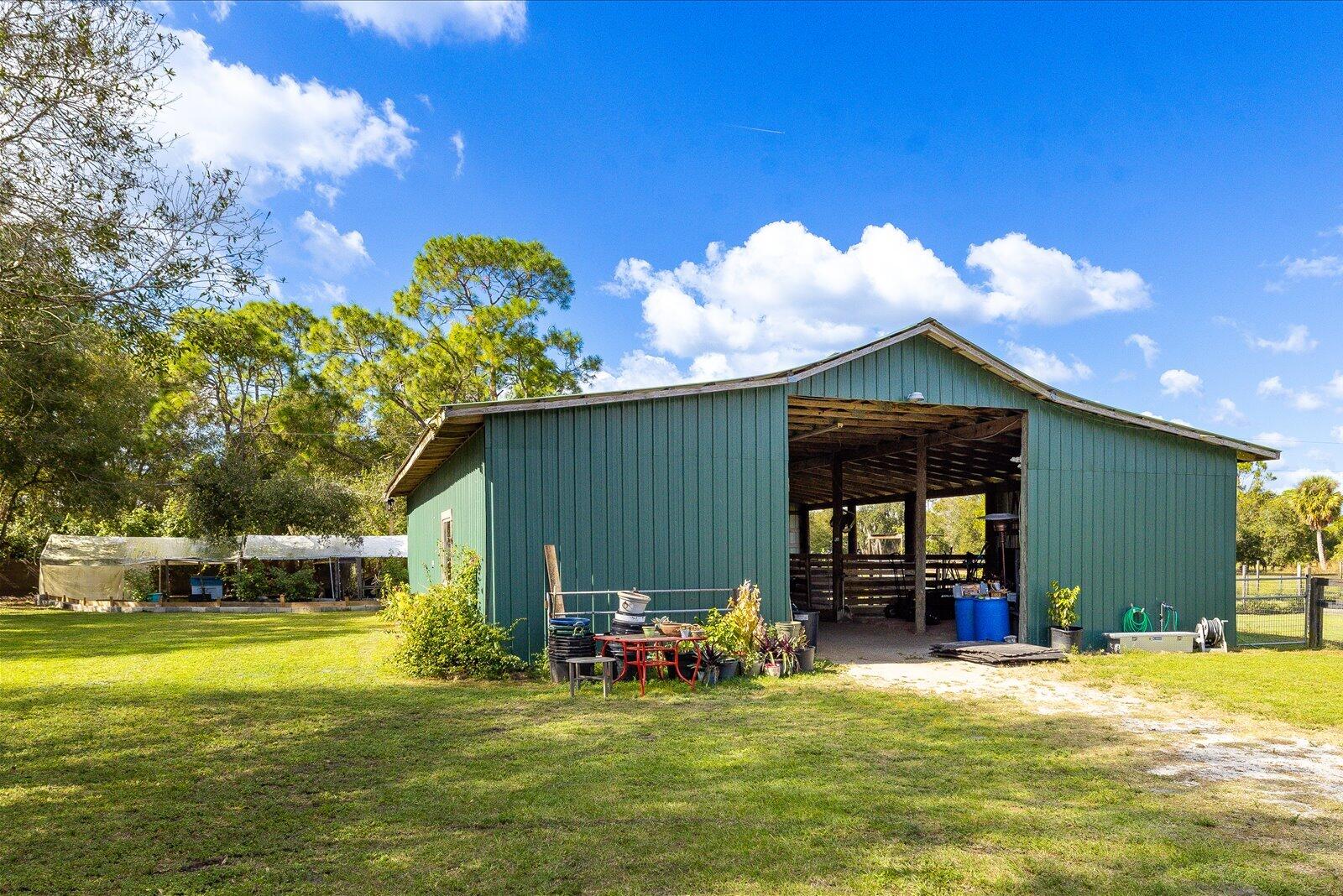 23801 Southwest Martin Highway Okeechobee, FL 34974 - Photo 24 of 85 a view of a house with backyard patio and swimming pool