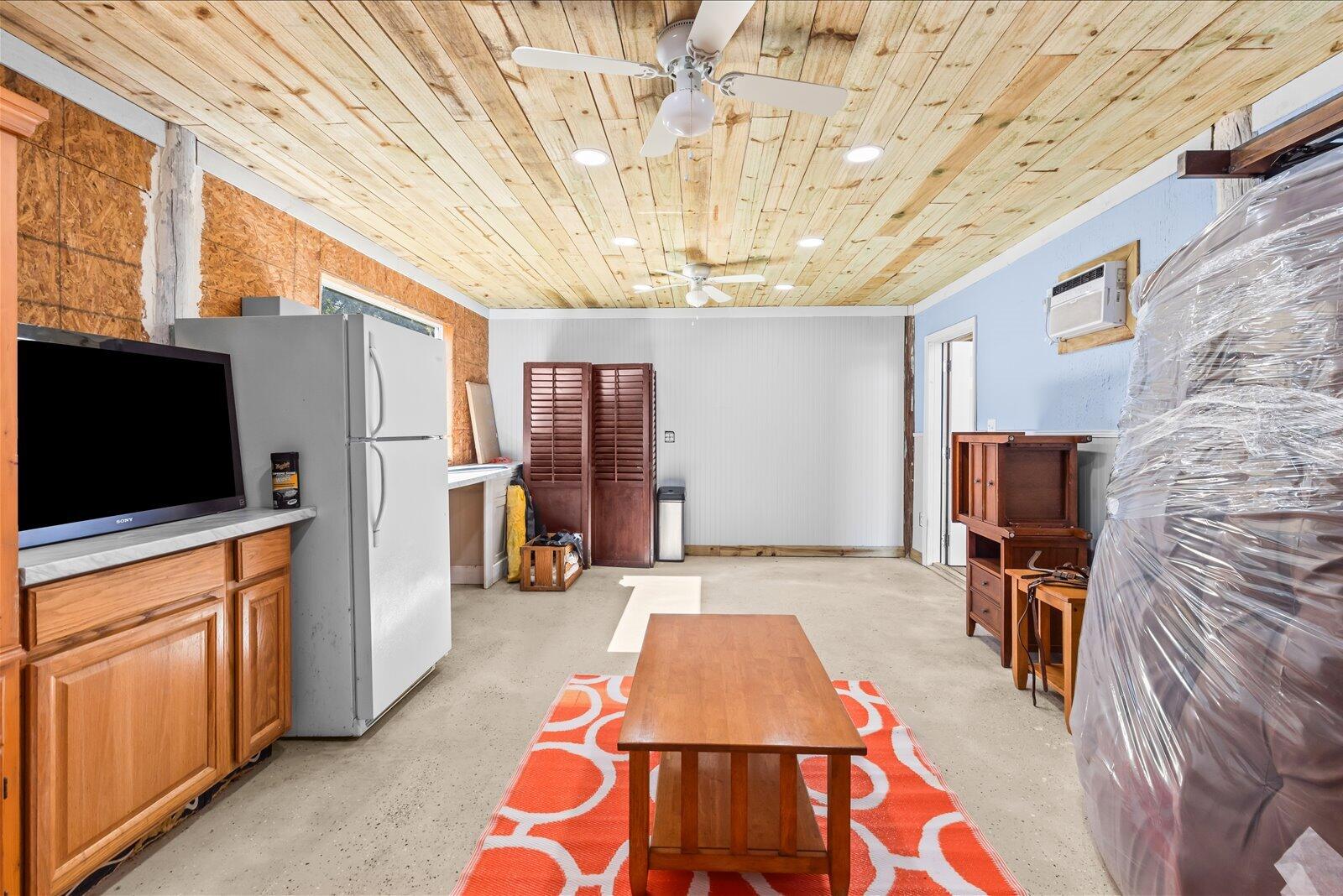 23801 Southwest Martin Highway Okeechobee, FL 34974 - Photo 29 of 85 a room with wooden furniture and flat screen tv