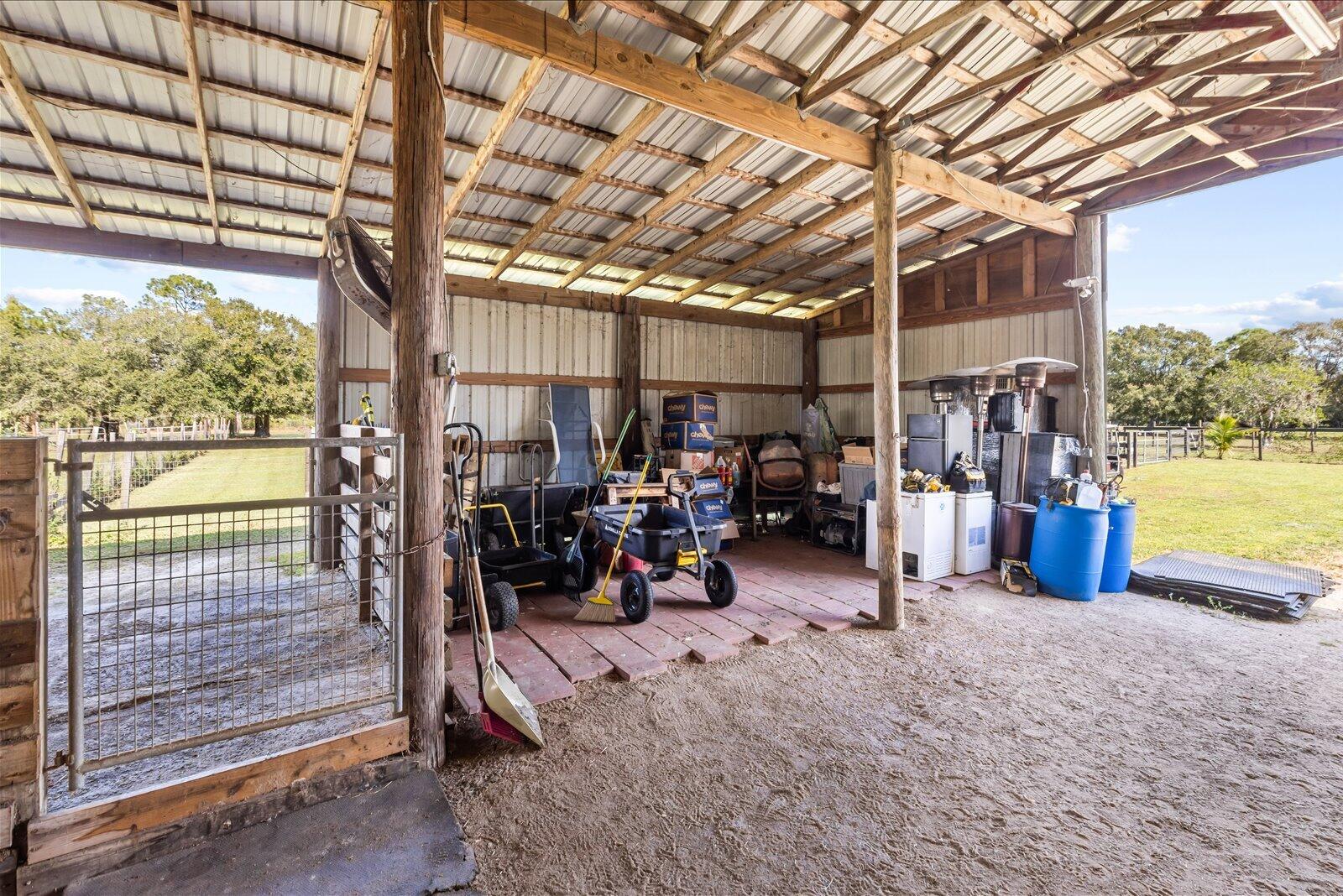 23801 Southwest Martin Highway Okeechobee, FL 34974 - Photo 32 of 85 a view of a bike garage