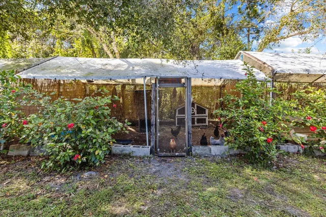a kitchen with a sink and a large window