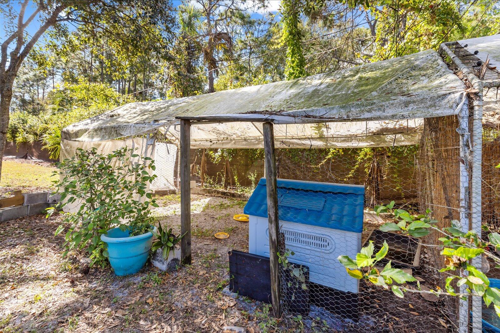 23801 Southwest Martin Highway Okeechobee, FL 34974 - Photo 36 of 85 a view of a garden with potted plants