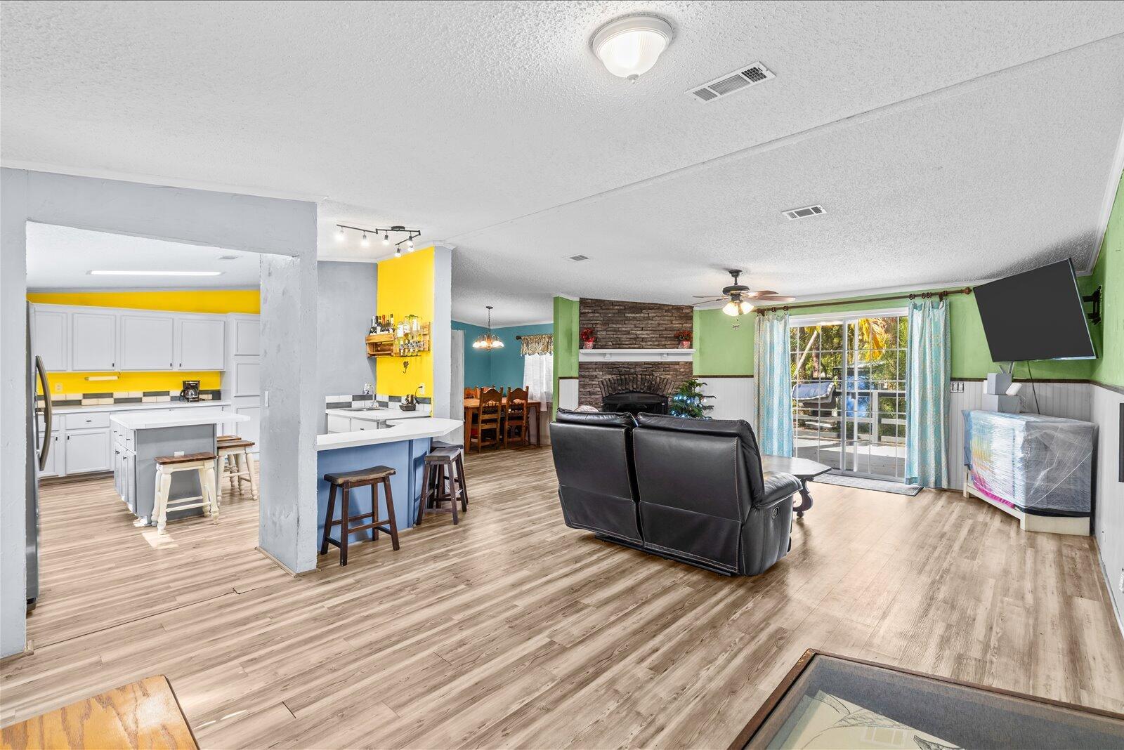 23801 Southwest Martin Highway Okeechobee, FL 34974 - Photo 46 of 85 a living room with furniture and a flat screen tv