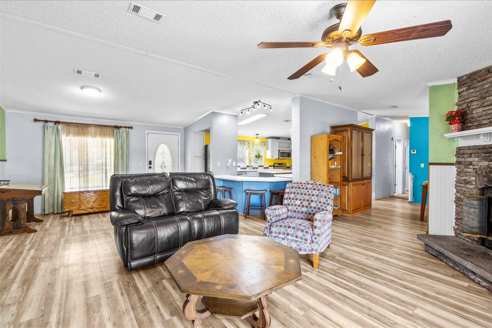 23801 Southwest Martin Highway Okeechobee, FL 34974 - Photo 48 of 85 a living room with furniture and a wooden floor