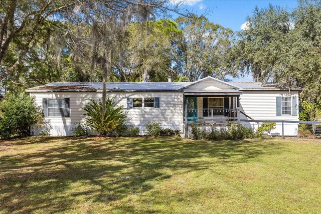 a view of a balcony with wooden floor