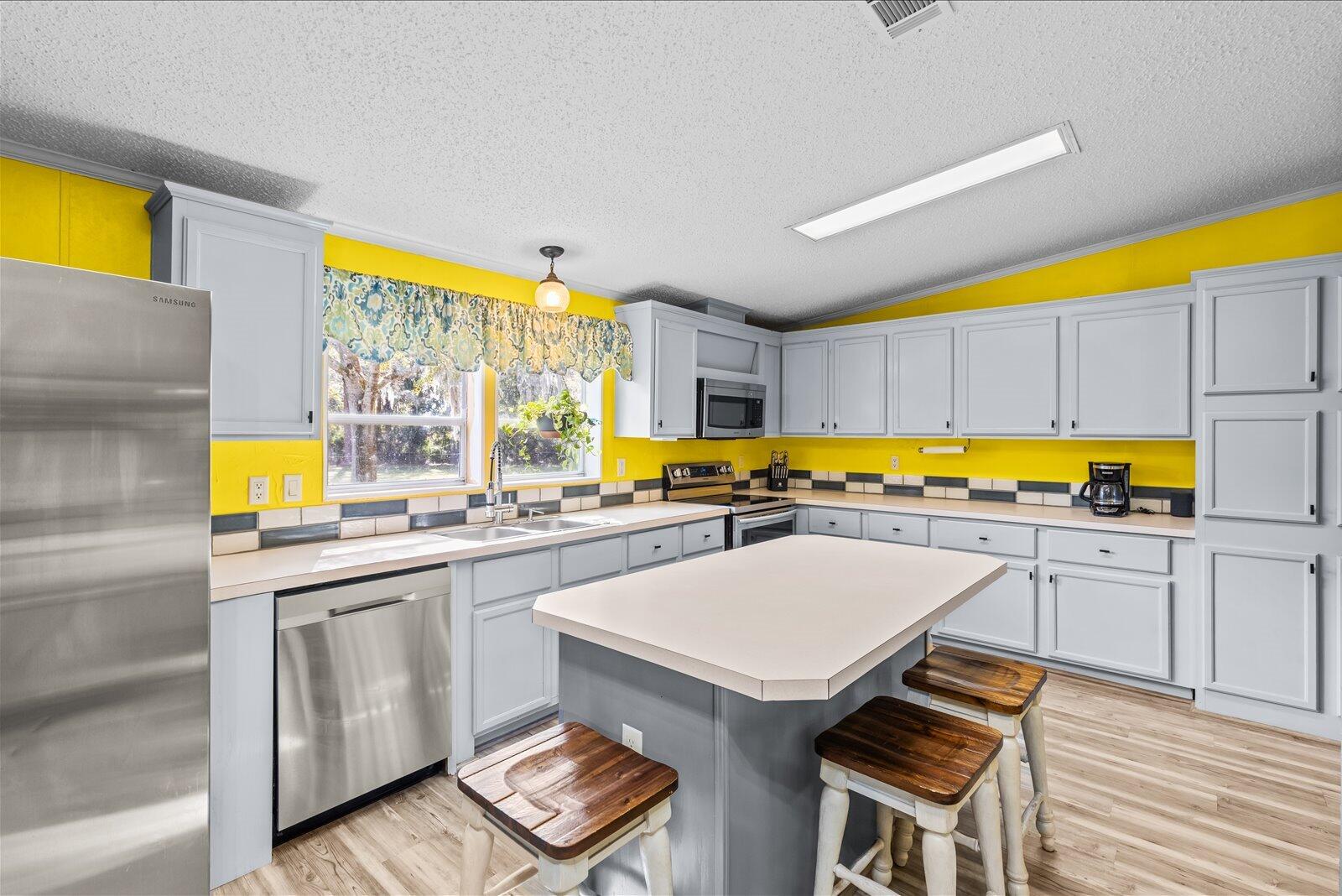 23801 Southwest Martin Highway Okeechobee, FL 34974 - Photo 52 of 85 a kitchen with a sink and cabinets