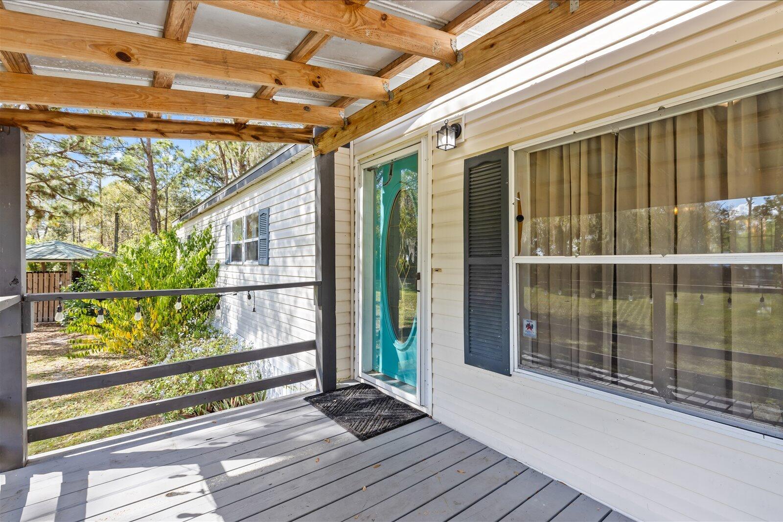 23801 Southwest Martin Highway Okeechobee, FL 34974 - Photo 7 of 85 a view of a balcony with wooden floor