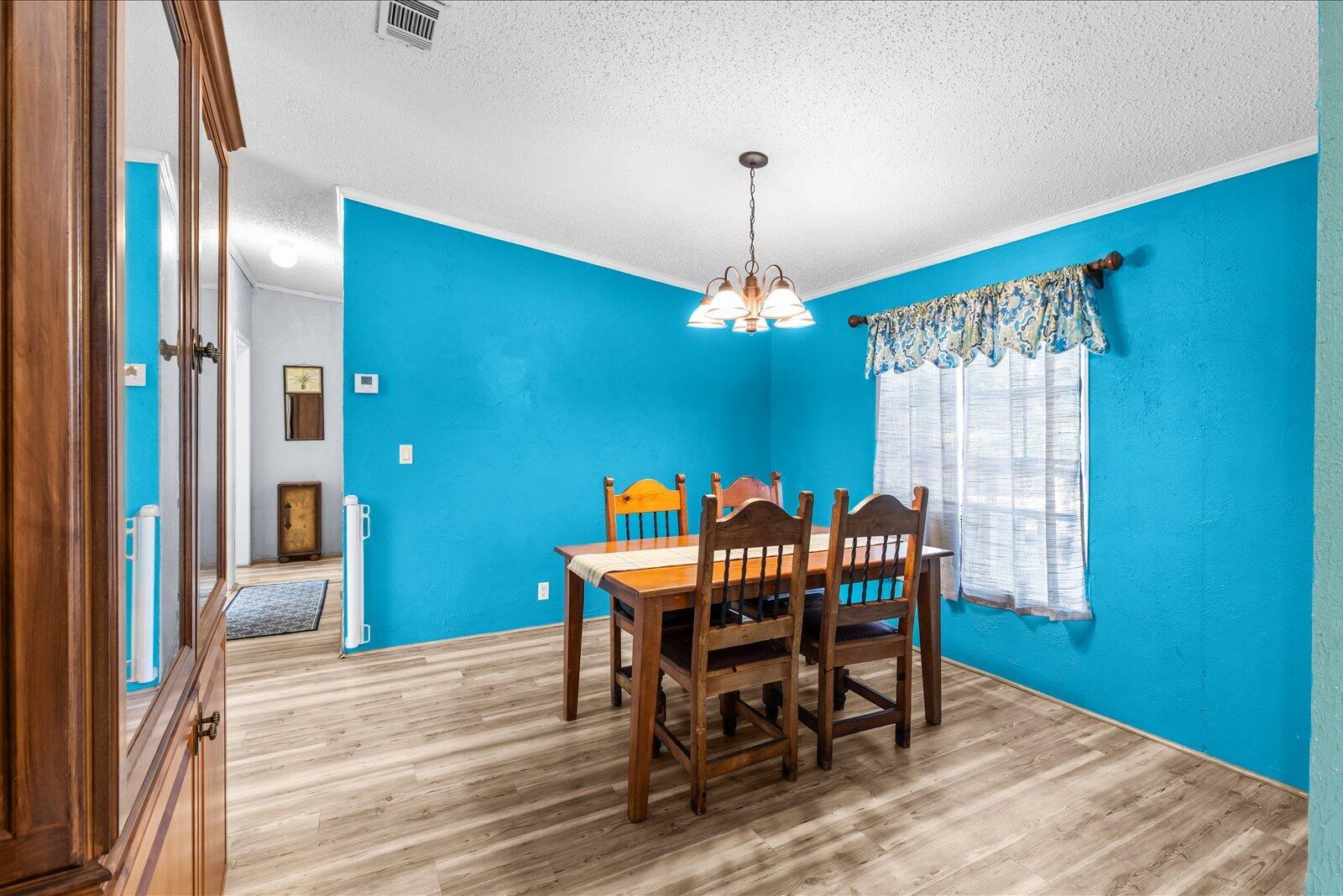 23801 Southwest Martin Highway Okeechobee, FL 34974 - Photo 73 of 85 a view of a dining room with furniture window and wooden floor