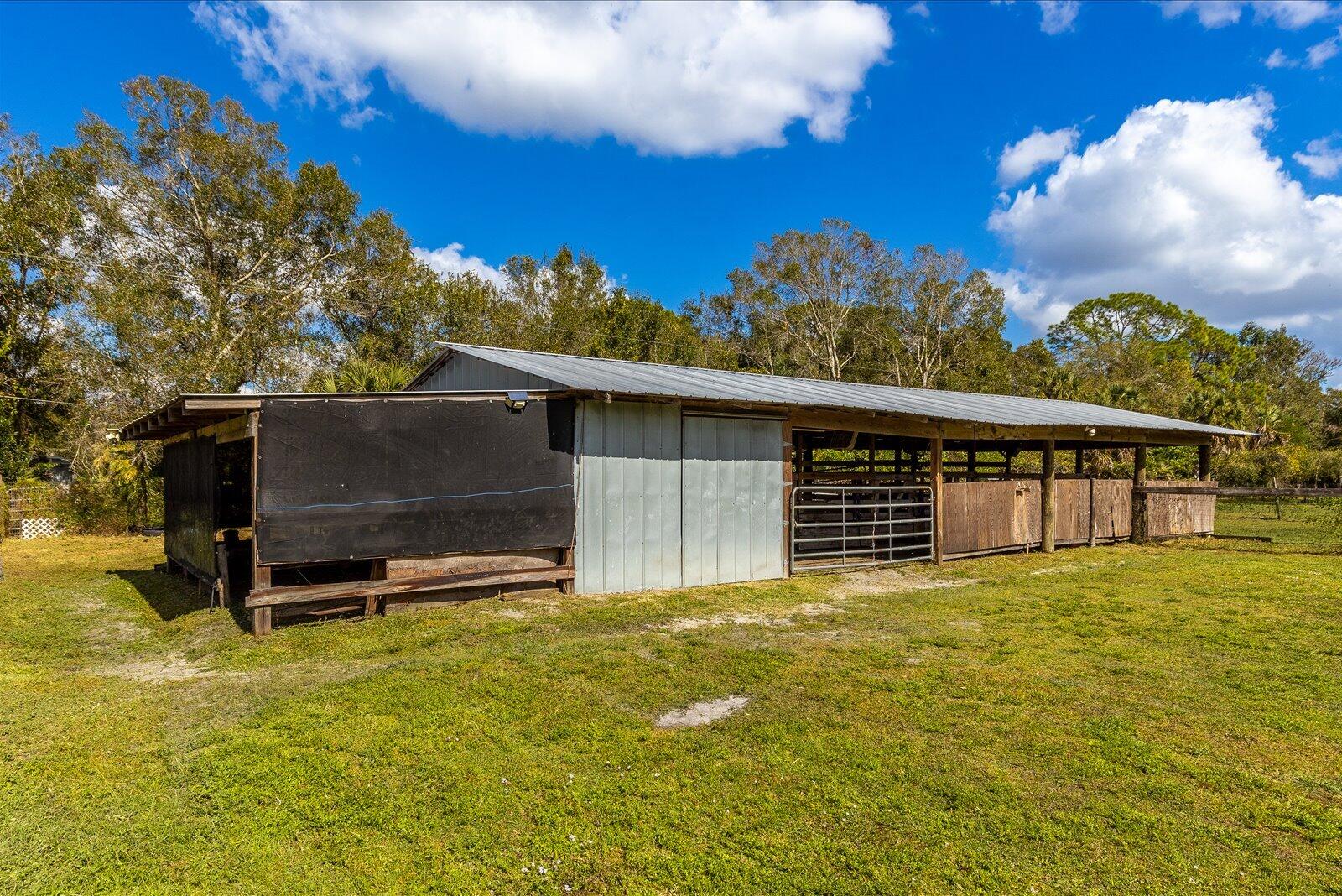 23801 Southwest Martin Highway Okeechobee, FL 34974 - Photo 10 of 85 a view of a house with a yard