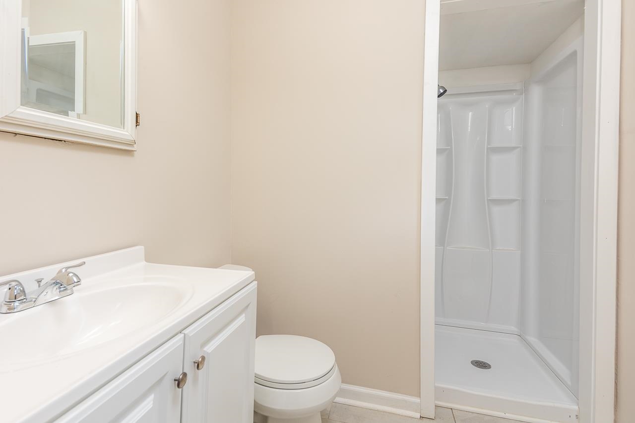 a bathroom with a sink toilet and vanity