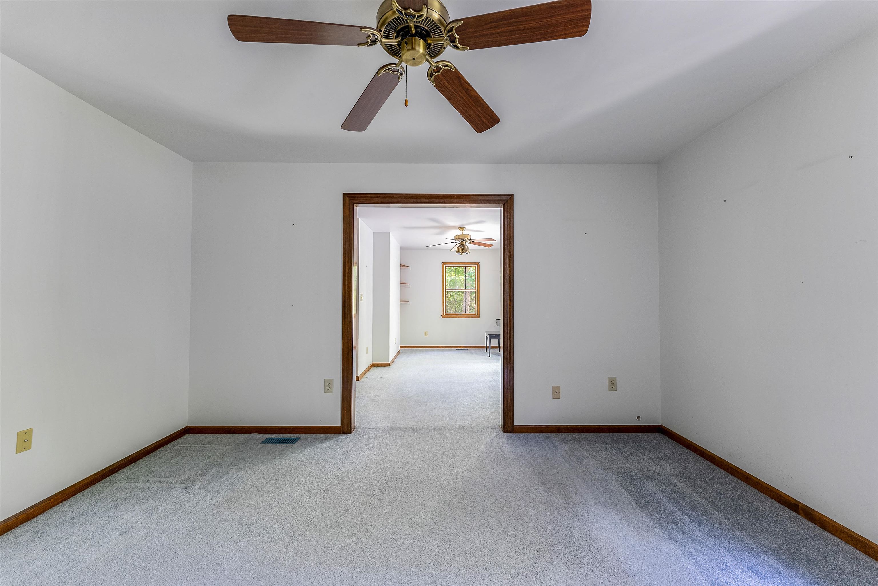 233 Fidler Road Dennisville, NJ 08270 - Photo 18 of 31 an empty room with chandelier fan