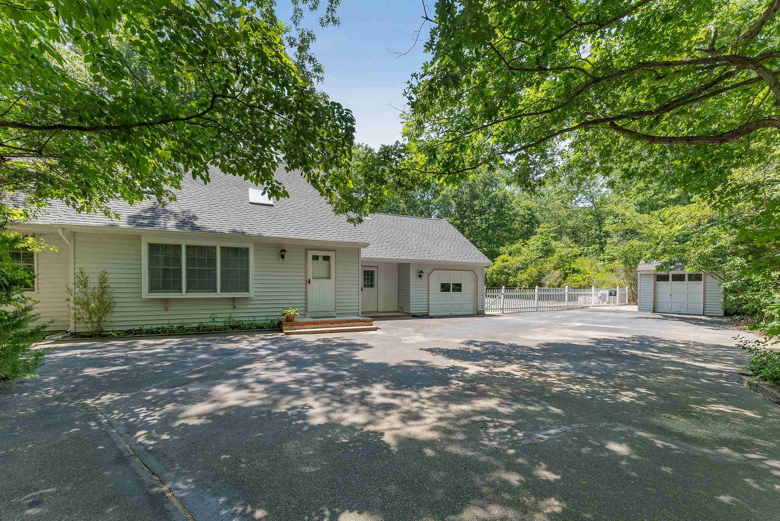 233 Fidler Road Dennisville, NJ 08270 - Photo 2 of 31 a front view of a house with a garden