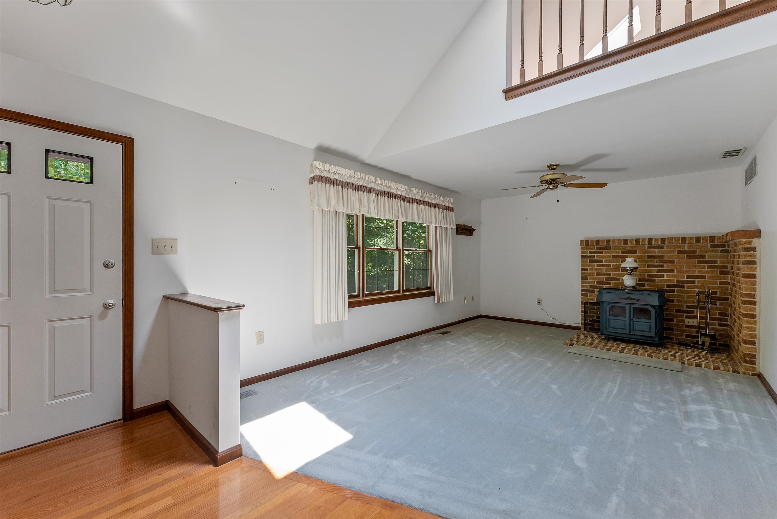 233 Fidler Road Dennisville, NJ 08270 - Photo 6 of 31 an empty room with windows fireplace and windows
