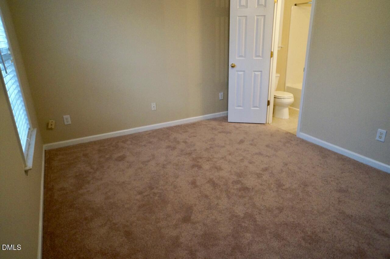 2444 Pumpkin Ridge Way Raleigh, NC 27604 - Photo 12 of 19 an empty room with windows