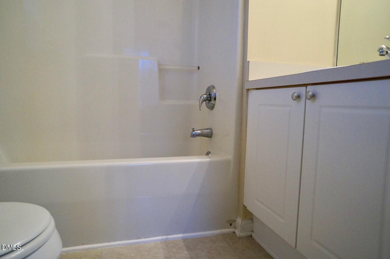 2444 Pumpkin Ridge Way Raleigh, NC 27604 - Photo 13 of 19 a bathroom with a bathtub