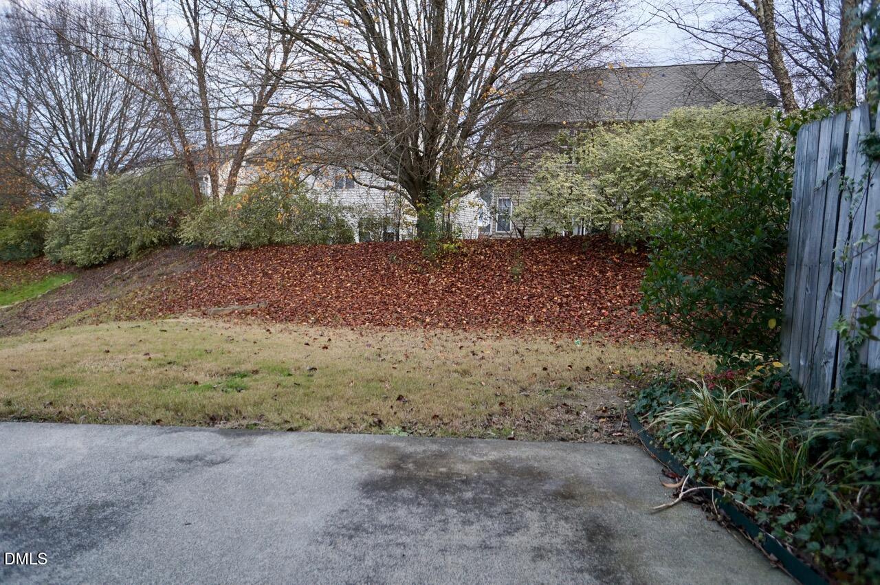 2444 Pumpkin Ridge Way Raleigh, NC 27604 - Photo 14 of 19 a view of dirt yard with a large tree