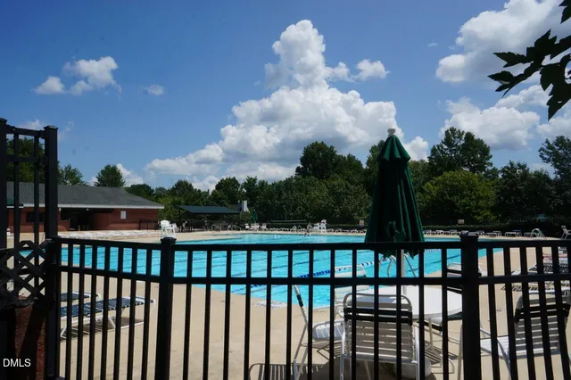 a view of a balcony with wooden fence