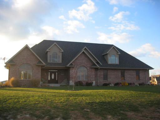 1620 North 1590th Road Streator, IL 61364 - Photo 1 of 1 a front view of a house with a garden
