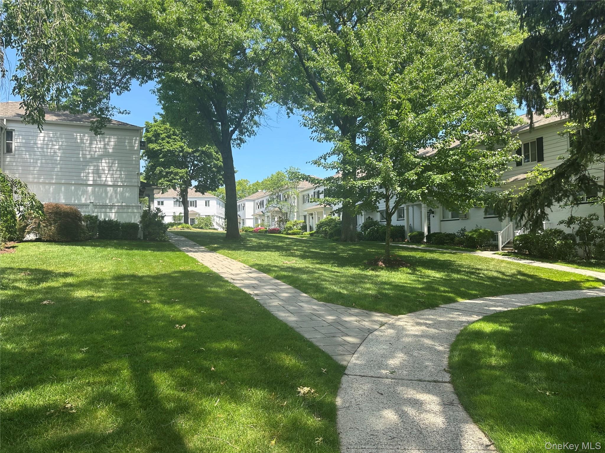 129 Fenimore Road, Unit 129B Mamaroneck, NY 10543 - Photo 12 of 19 Park like setting of Fenimore Gardens. Each building is 2 floors. # 129B shares entry hall with 1 other unit.