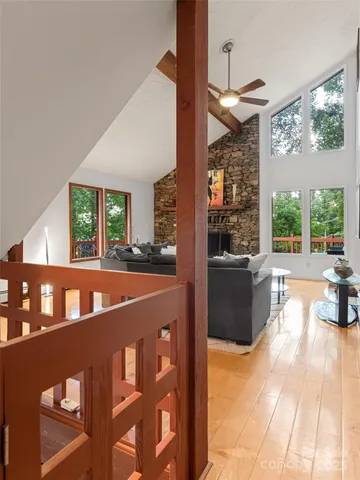 a view of an chairs and table in a living room